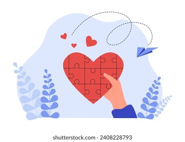 Puzzled heart in hand vector illustration. Heart made of puzzle pieces as symbol of love and romance.