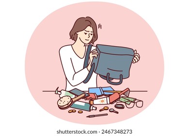 Puzzled woman shakes out contents of bag on table trying to find wallet with money or mobile phone. Girl is embarrassed because of mess in bag causing inconvenience and loss of wallet