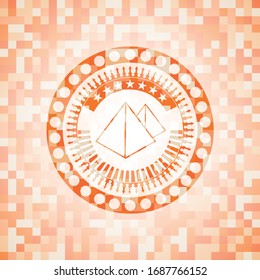 pyramids icon inside abstract orange mosaic emblem