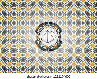 pyramids icon inside arabesque badge background. arabic decoration.