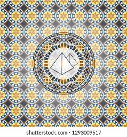 pyramids icon inside arabesque badge background. arabic decoration.