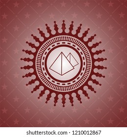 pyramids icon inside badge with red background