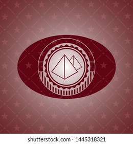 pyramids icon inside badge with red background