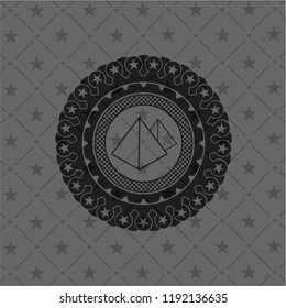 pyramids icon inside black emblem