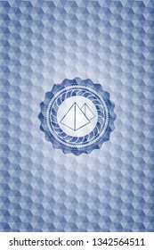 pyramids icon inside blue badge with geometric pattern.