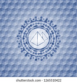 pyramids icon inside blue emblem with geometric pattern background.