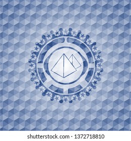 pyramids icon inside blue polygonal emblem.