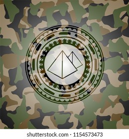 pyramids icon inside camouflaged emblem