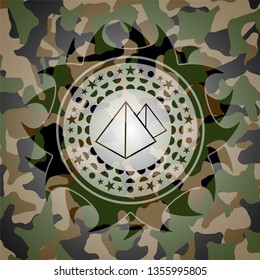 pyramids icon inside camouflaged emblem