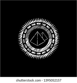 pyramids icon inside chalk emblem