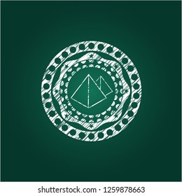 pyramids icon inside chalkboard emblem written on a blackboard