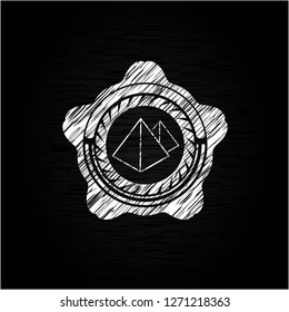 pyramids icon inside chalkboard emblem