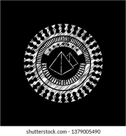 pyramids icon inside chalkboard emblem written on a blackboard