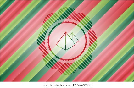 pyramids icon inside christmas style badge..