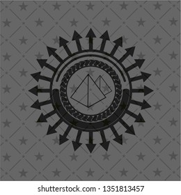 pyramids icon inside dark badge or emblem
