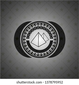 pyramids icon inside dark badge or emblem