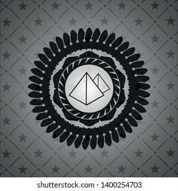 pyramids icon inside dark badge