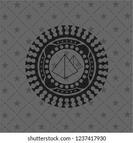 pyramids icon inside dark emblem