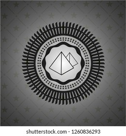 pyramids icon inside dark emblem
