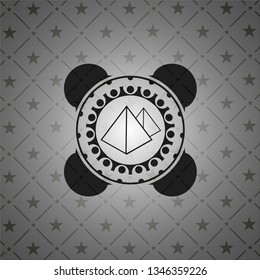 pyramids icon inside dark emblem. Retro