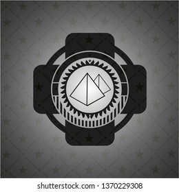 pyramids icon inside dark emblem. Retro