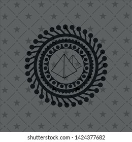 pyramids icon inside dark emblem