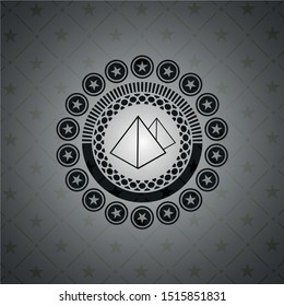 pyramids icon inside dark emblem. Retro