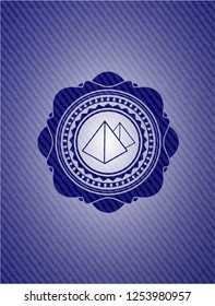 pyramids icon inside denim background