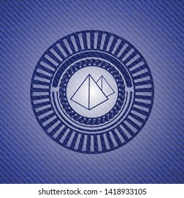 pyramids icon inside denim background