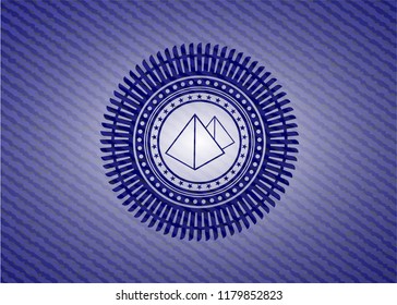pyramids icon inside emblem with denim texture