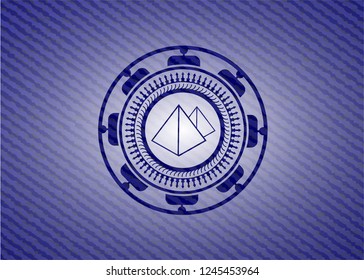 pyramids icon inside emblem with denim texture
