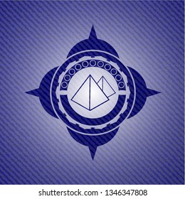 pyramids icon inside emblem with jean background