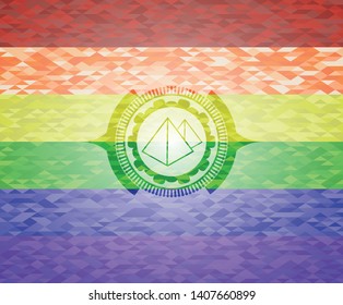 pyramids icon inside emblem on mosaic background with the colors of the LGBT flag