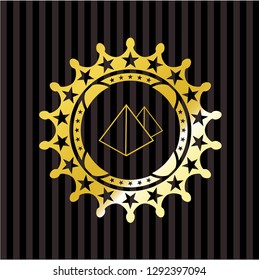 pyramids icon inside gold emblem or badge