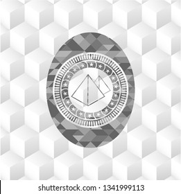 pyramids icon inside grey badge with geometric cube white background