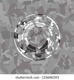 pyramids icon inside grey camouflaged emblem