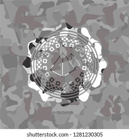 pyramids icon inside grey camouflaged emblem