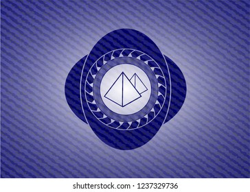 pyramids icon inside jean or denim emblem or badge background
