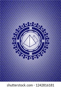 pyramids icon inside jean or denim emblem or badge background