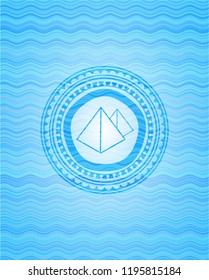 pyramids icon inside light blue water badge.