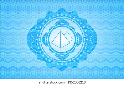 pyramids icon inside light blue water style emblem.