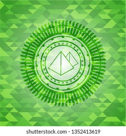 pyramids icon inside realistic green mosaic emblem