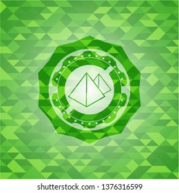 pyramids icon inside realistic green emblem. Mosaic background