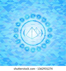 pyramids icon inside realistic light blue mosaic emblem
