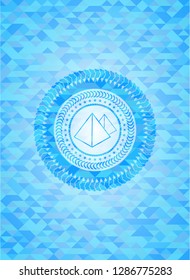 pyramids icon inside realistic sky blue mosaic emblem