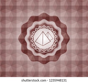 pyramids icon inside red emblem or badge with abstract geometric polygonal pattern background. Seamless.
