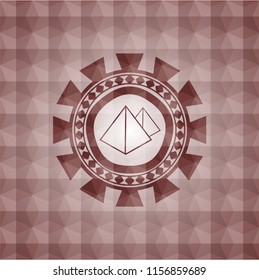 pyramids icon inside red seamless emblem or badge with geometric pattern background.