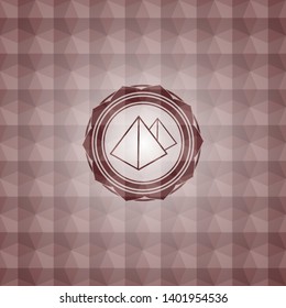 pyramids icon inside red seamless emblem or badge with geometric pattern background.