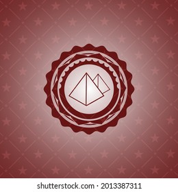 pyramids icon inside retro red emblem. 