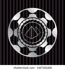 pyramids icon inside silver emblem